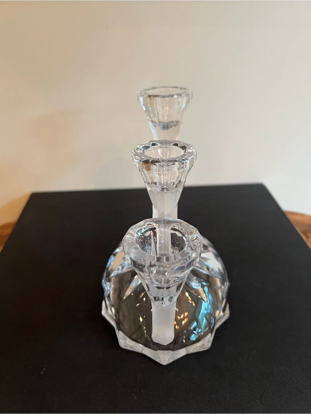 Glass candle holder Features a unique asymmetrical 